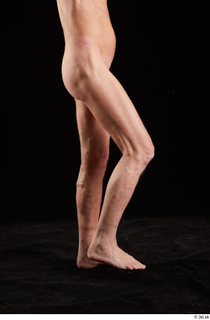 Joseph  1 flexing leg nude side view sitting 0002.jpg